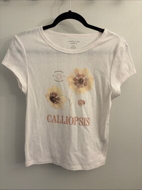 American Eagle Outfitters White Baby Tee with Yellow Floral 'Calliopsis' Graphic